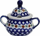 Conical sugar box with hole for a sugar-spoon in the...