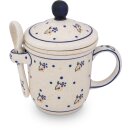 Tee mug with cover tea strainer and spoon in the decor 111
