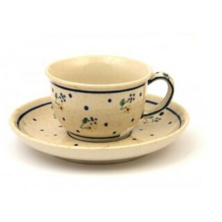 Coffee cup with curved out edge and saucer in the decor 111